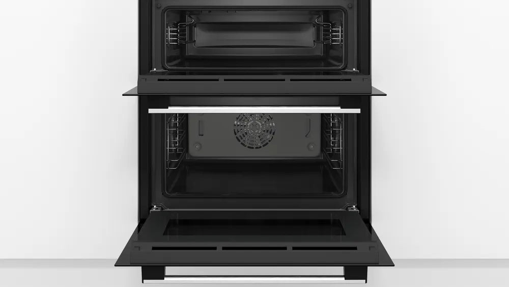 Bosch Series 4 NBS533BS0B Electric Built-Under Electric Double Oven in Stainless Steel from HomeWise Appliances. Stock photo showing interior of cavities.